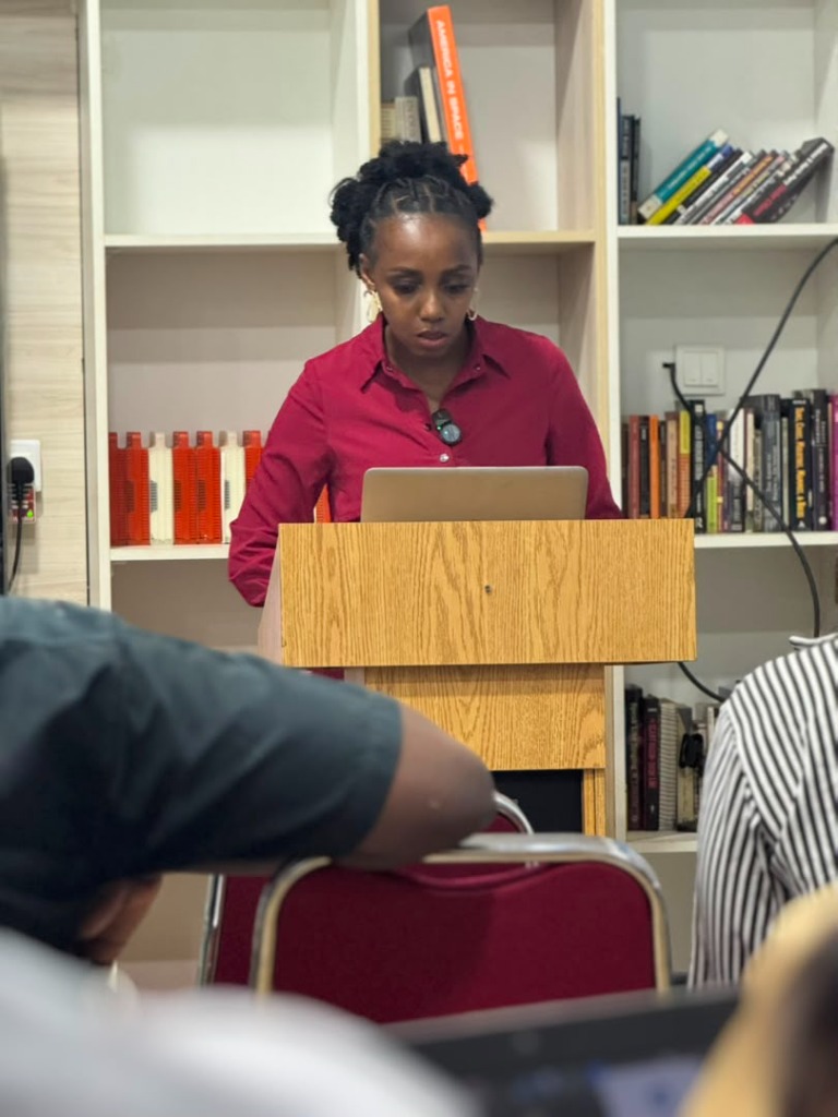 Mary Mmoh speaking at podium