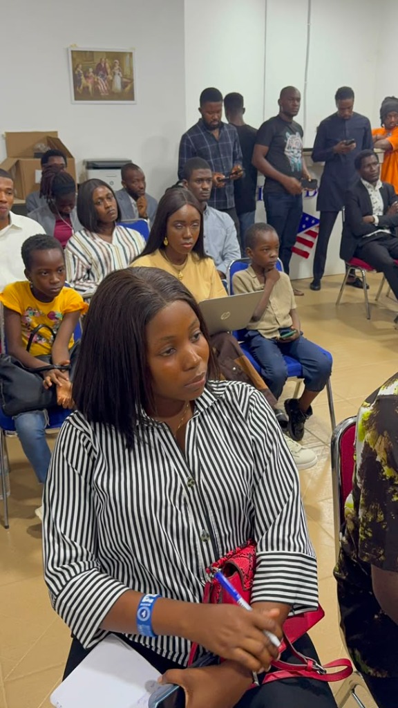 Audience members listening